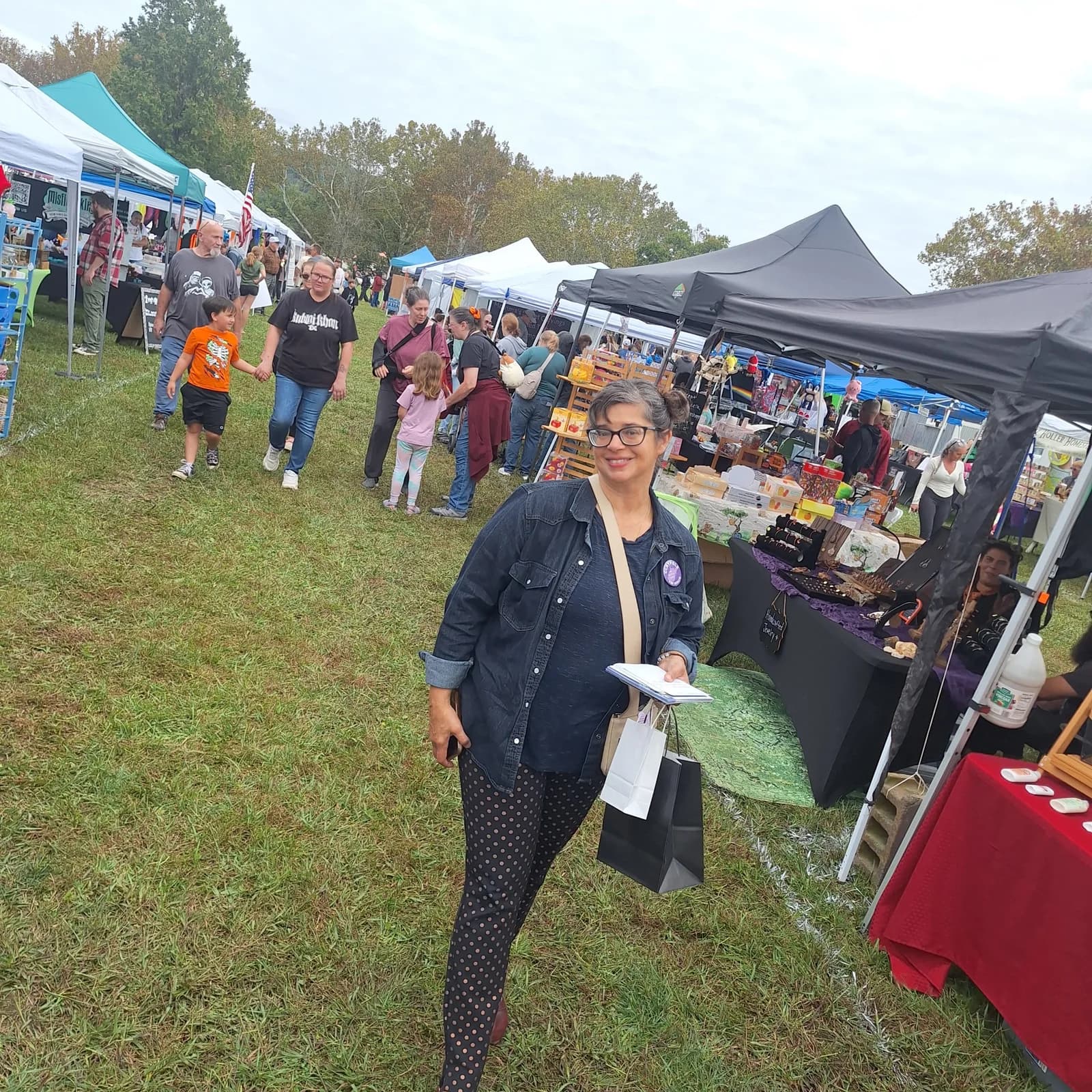 Rachel Fetty Anderson walks through a community festival with supporters.